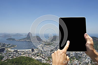 Traveling Tourist Using Tablet at Rio de Janeiro Brazil Skyline Stock Photo