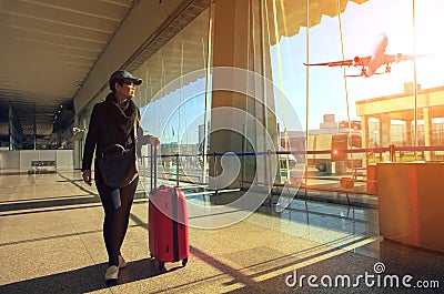 Traveling woman and luggage walking in airport terminal and air Stock Photo