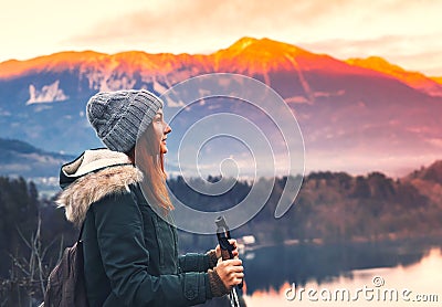 Traveling young woman looking on sunset on Bled Lake, Slovenia, Stock Photo