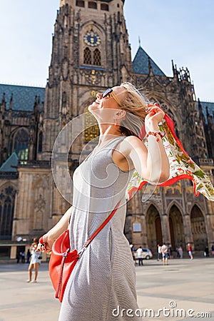 Traveller female on the background of the St. Vitus Cathedral, Prague, Czech Republic Stock Photo