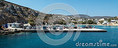 Travellers waiting for the ferry, at the port on Iraklia island Greece. Editorial Stock Photo