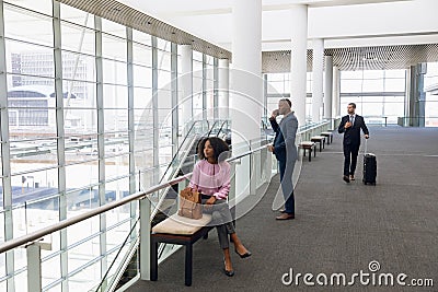 Travelling business people in modern corridor Stock Photo