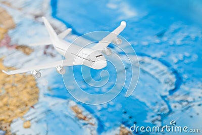 Travelling, tourism and all things related series - plane over world map Stock Photo