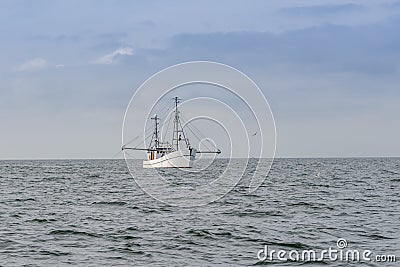 A trawling fishing boat Stock Photo