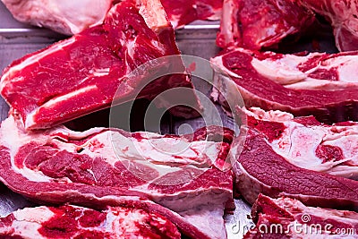 Tray butcher large chunks of veal steaks bone soup base for a rich selection of meat sauce cooking dinner Stock Photo