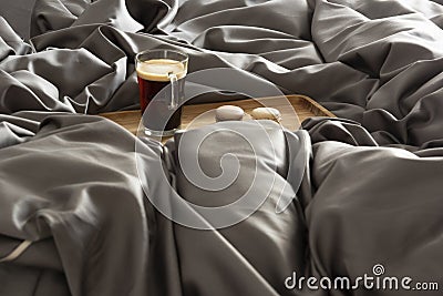 Tray with coffee in a large bed in a king size bedroom Stock Photo