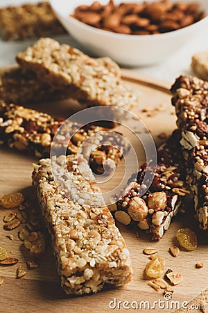 Tray with granola bars and bowl with almond, close up Stock Photo