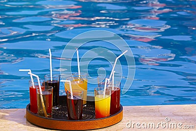 Tray with many drinks on the poolside Stock Photo