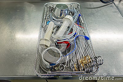 tray for surgical instruments contains various assorted instruments for performing an operation Stock Photo