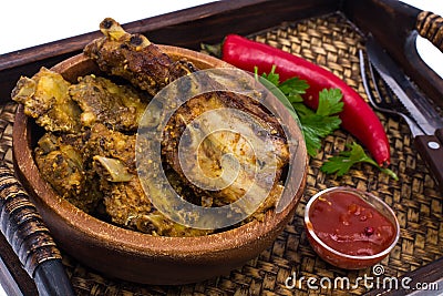 Tray, wooden bowl with spicy ribs, ketchup Stock Photo