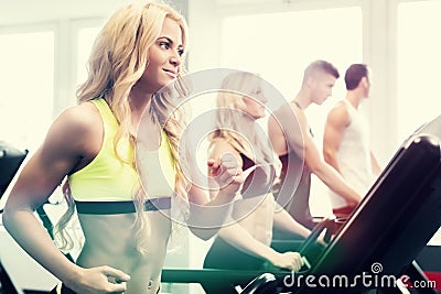 Treadmill group exercising in fitness gym Stock Photo