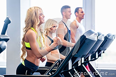 Treadmill group exercising in fitness gym Stock Photo