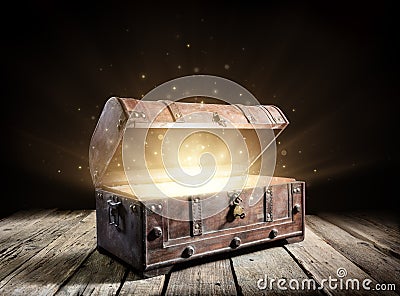 Treasure Chest - Open Ancient Trunk With Glowing Magic Lights Stock Photo