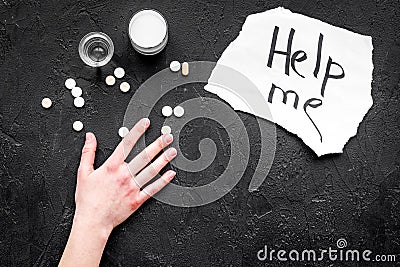 Treat alcohol dependence. Words Help me near pills on black background top view copy space Stock Photo