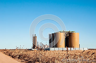Treater to separate water from oil and tanks to store the oil Stock Photo