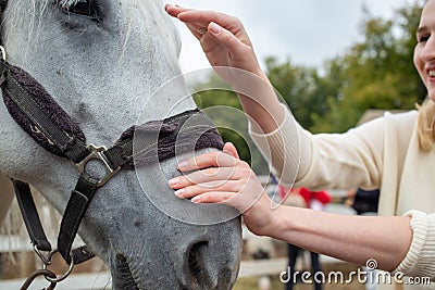 Treating from depression with the help of a horse. Stock Photo