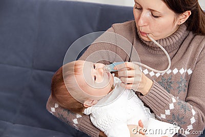 Treatment of the common cold in baby Stock Photo