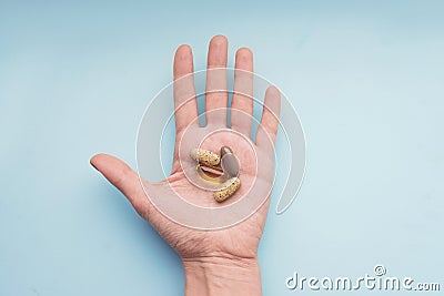 Treatment and pharmacy concept. Colorful pills in the hand Stock Photo