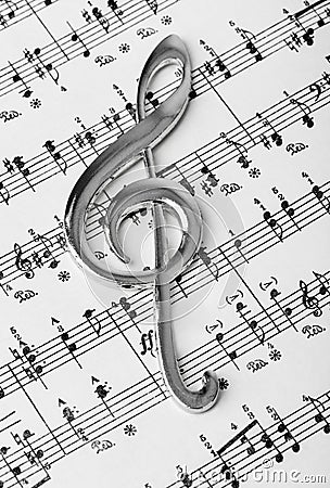 Treble clef on music sheet - musical background Stock Photo