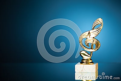 Treble clef symbol trophy on blue background Stock Photo