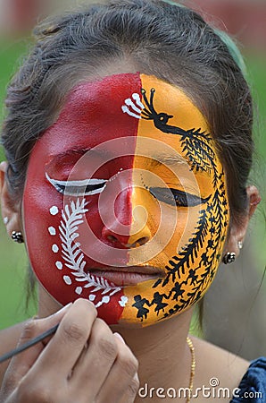 Treditional Indian painting designs on Face Editorial Stock Photo