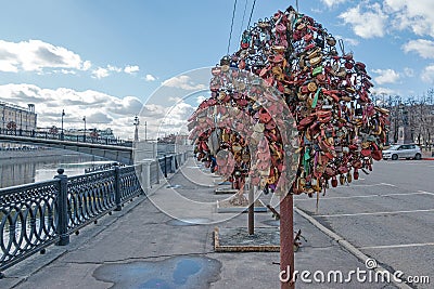 Tree with the locked wedding locks on the Bridge of Love. Editorial Stock Photo