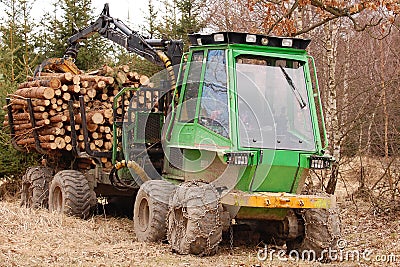 Tree log hydraulic manipulator - tractor Stock Photo