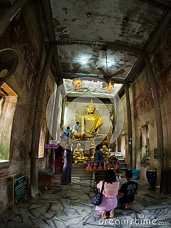 Tree root covering ancient temple : Wat Bang Kung at Amphawa Editorial Stock Photo