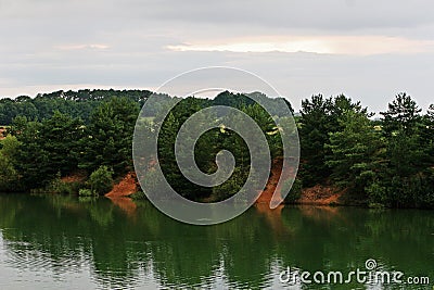 Trees border reflection at the lake Stock Photo