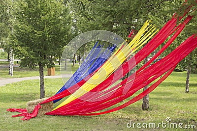 Trees in the Park are decorated with colored ribbons Stock Photo