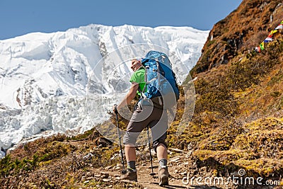 Trekker in front of Manaslu glacier on Manaslu circuit trek in N Stock Photo