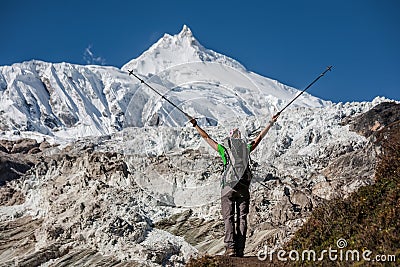 Trekker in front of Manaslu glacier on Manaslu circuit trek in N Stock Photo