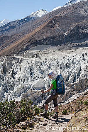 Trekker in front of Manaslu glacier on Manaslu circuit trek in N Stock Photo