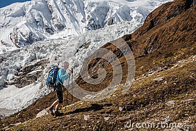 Trekker in front of Manaslu glacier on Manaslu circuit trek in N Stock Photo