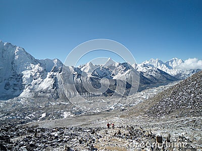 Trekkers looking to a beautiful scenery in Everest Base Camp Stock Photo