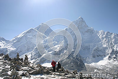 Trekkers looking at the top of Mount Everest Editorial Stock Photo