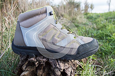 Trekking boot at the countryside Stock Photo