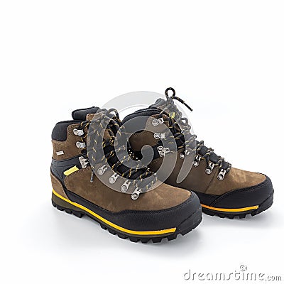 Trekking boots in brown nubuck and black vinyl. Stock Photo
