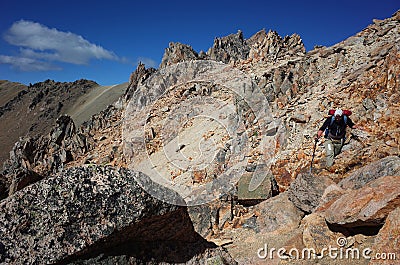 Trekking in Patagonia deserted mountains, Nahuel Huapi National Park, Man hiking on Cerro Catedral mountain steep Stock Photo