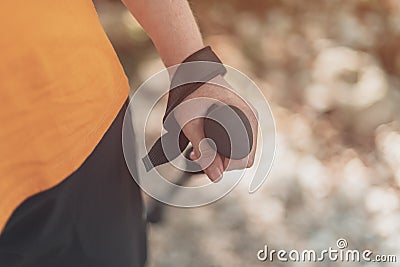 Trekking pole in female hiker hand Stock Photo