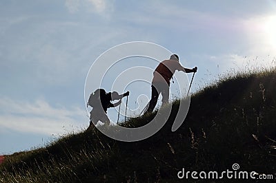 Trekking silhouettes Stock Photo