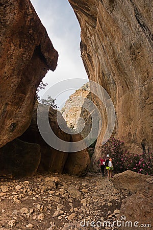 Trekking on a winding path through Lissos gorge near Sougia, south-west coast of Crete island Editorial Stock Photo