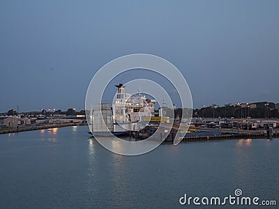 TRELLEBORG, SWEDEN - August 21, 2019: Baltic ferry boats at Trelleborg harbor Swedish port, blue hour evening. Editorial Stock Photo