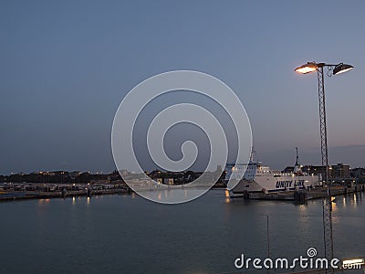 TRELLEBORG, SWEDEN - August 21, 2019: Night view of Trelleborg harbor with Baltic ferry boats, Swedish port, blue hour evening Editorial Stock Photo