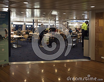 TRELLEBORG, SWEDEN - August 21, 2019: view on Interrior of restaurant buffet, snack bar on Stena line ferry with eating tourists Editorial Stock Photo