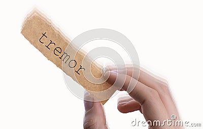 Tremor word on torn notepaper in hand Stock Photo