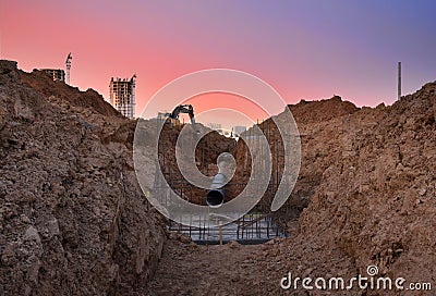 Trench for laying external sewer pipes. Sewage drainage system for a multi-story building. Civil infrastructure pipe, water lines Stock Photo