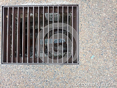 The trench with the rusty iron tracks closed at the top and with concrete floors. Stone floor. Stock Photo