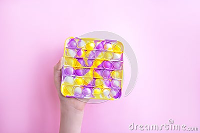 Trend bright multicolored antistress toy Pop it Editorial Stock Photo