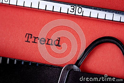Trend. Text written on a red paper made by old typewriter Stock Photo